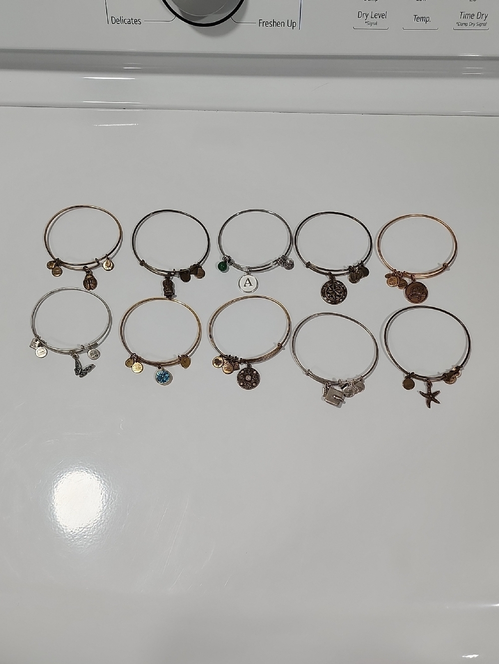 9 Alex & Ani Bracelets, 1 Love This Life Bracelet.